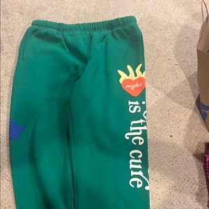 The Mayfair Group sweatpants in a vibrant green.